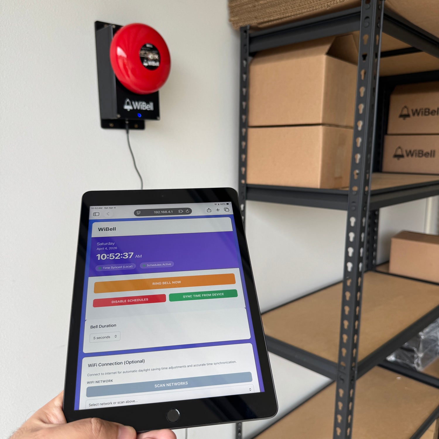 WiBell scheduling app on iPad in warehouse setting